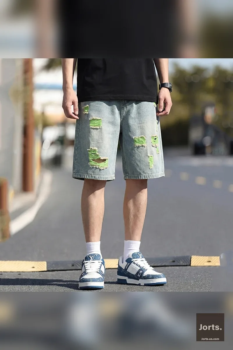 Men's vintage colourful ripped jorts with green lining, front view, baggy fit